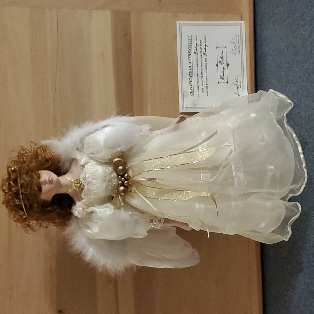 Collectable porcelain doll, by century collection